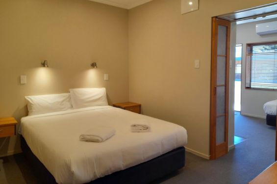 Queen-size beds at Tongariro Junction Accommodation